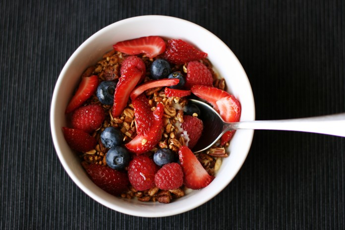 Favorite granola with puffed grains, pecans, maple syrup, and honey on alickofsalt.com